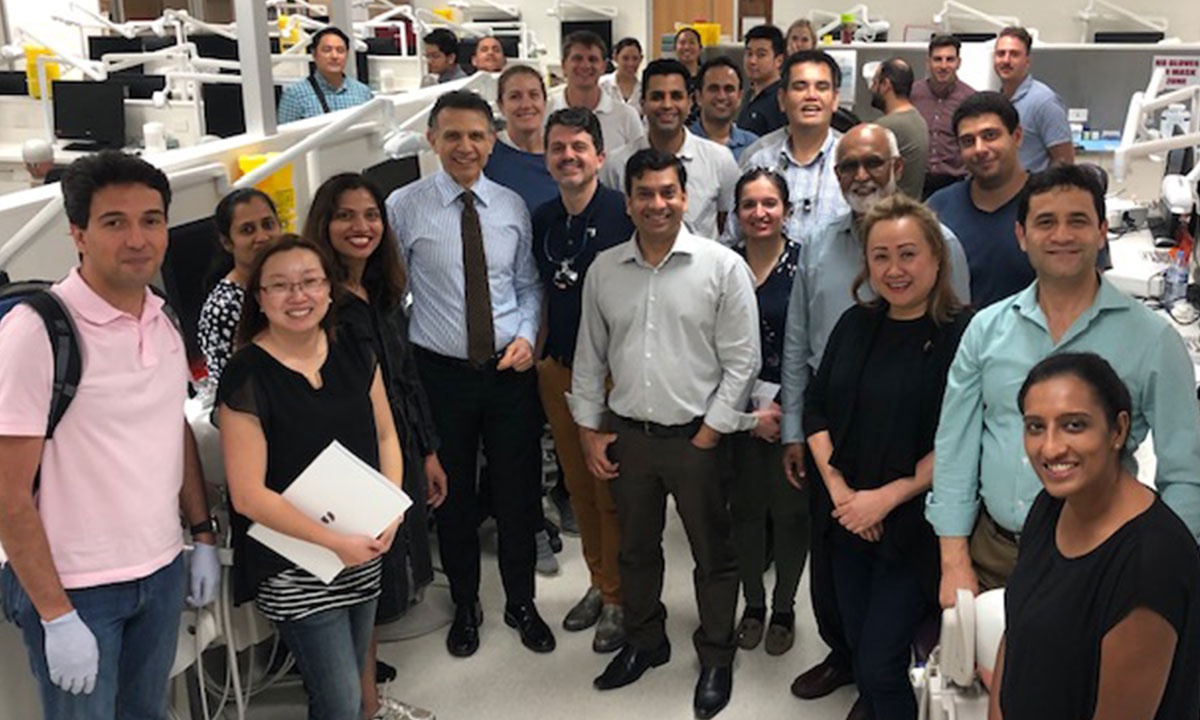 Prof Quaranta with course participants at a hands-on implant dentistry workshop